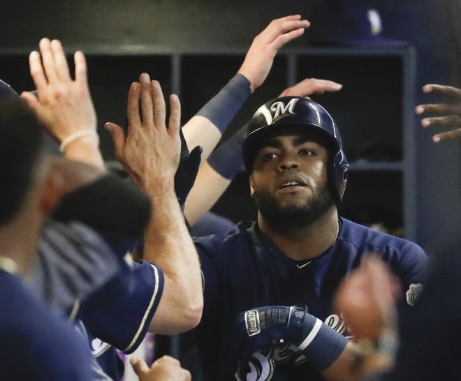 Milwaukee Brewers' Jesus Aguilar celebrates after hitting a home run during the third inning of a baseball game against the Kansas City Royals on Tuesday in Milwaukee. [Morry Gash/Associated Press]