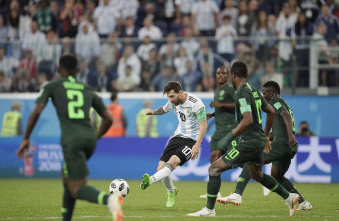 Argentina's Lionel Messi, center, kicks the ball during the group D match against Nigeria at the 2018 World Cup in St. Petersburg, Russia, on Tuesday. [AP Photo / Dmitri Lovetsky]
