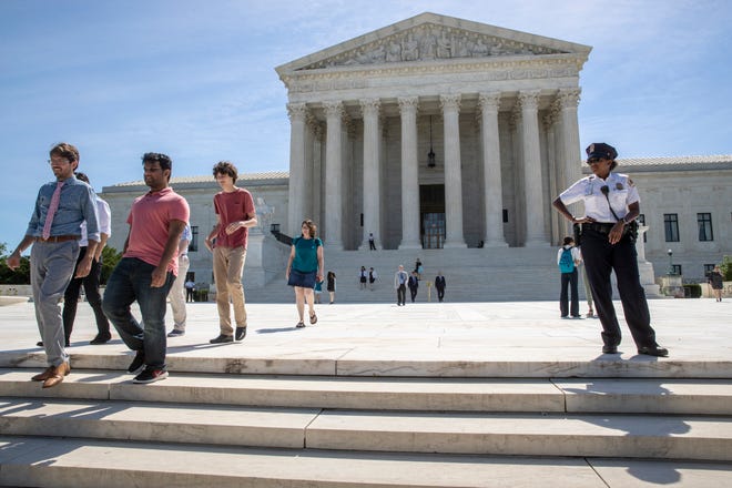 Visitors depart the Supreme Court early Monday, June 25, 2018. The justices are expected to hand down decisions this week as the court's term comes to a close. (AP Photo/J. Scott Applewhite)
