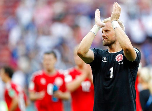 Denmark goalkeeper Kasper Schmeichel applauds to supporters after the group C match between Denmark and France at the 2018 soccer World Cup at the Luzhniki Stadium in Moscow, Russia, Tuesday, June 26, 2018. (AP Photo/David Vincent)