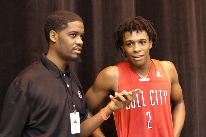 Charles "Scout" Clark, left, seen here with Fab 40 alum Malique Jacobs, has spearheaded a new NBA-combine style event for basketball players in eastern North Carolina. [Contributed photo]