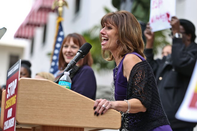This file photo from January 2016 shows Joanne McCall, president of Florida Education Association, greeting a crowd before giving a speech about the importance of education. On Tuesday, McCall announced the union's newest initiative: asking politicians to promise to increase teacher pay. [Andrea Cornejo/ Correspondent]