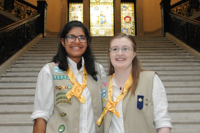 Sue Purohit, left, and Kaitlin Levangie, both of Lexington, receive the Girl Scout Gold Award at the Massachusetts Statehouse on June 8. [Courtesy Photo / Randy H. Goodman]
