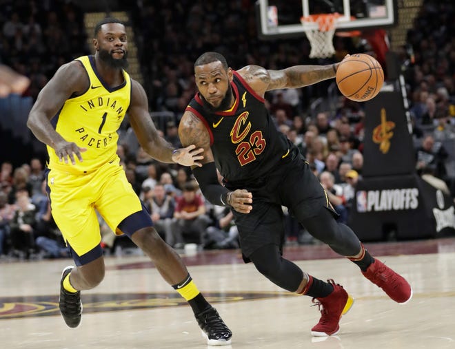 FILE - In this April 29, 2018, file photo, Cleveland Cavaliers' LeBron James (23) drives against Indiana Pacers' Lance Stephenson (1) in the first half of Game 7 of an NBA basketball first-round playoff series, Sunday, April 29, 2018, in Cleveland. The appeal for James to stay home is different now than it was eight years ago when he bolted for Miami. He’s more matured, and with three children and a burgeoning business empire, his priorities, responsibilities and goals are different. (AP Photo/Tony Dejak, File)