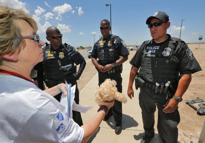 Randi Weingarten tries to deliver a teddy bear and other items for children to federal agents at the port-of-entry, Tuesday, June 26, 2018, in Fabens, Texas, along the international border where immigrant children are being held. The group tried to deliver items to the children housed in tents at the facility but were turned away. (AP Photo/Matt York)