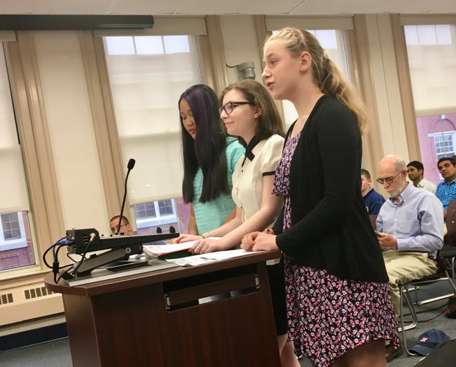 Elsa Rogers, right, Hannah Martuscello and Olivia Malone of Dover Youth to Youth urge the Dover City Council to vote for raising the age to possess, purchase and use tobacco products to 21 years old. [Brian Early/Fosters.com]