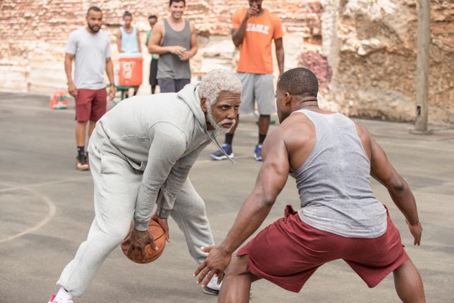 Uncle Drew (Kyrie Irving, left) shows a young pup how the game is played. [Lionsgate]