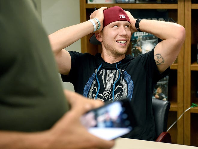 Super Bowl MVP Nick Foles takes a break from signing 600 copies of his book, "Believe It," at The Doylestown Bookshop on Thursday. [ART GENTILE / STAFF PHOTOJOURNALIST]