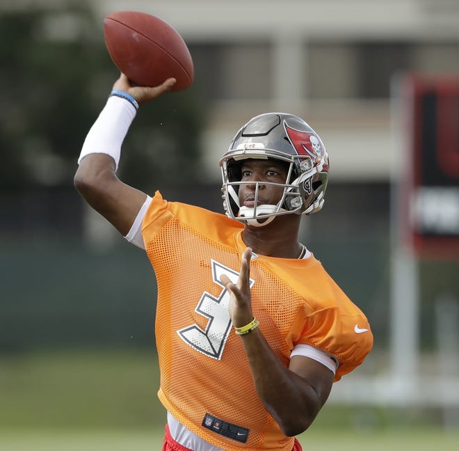 Tampa Bay Buccaneers quarterback Jameis Winston throws during an NFL football minicamp in Tampa. Winston has been suspended for the first three games of the regular season for violating the NFL's personal conduct policy. Winston says in a statement released on Facebook that the NFL informed him of their decision on Thursday. [AP Photo/Chris O'Meara, File]