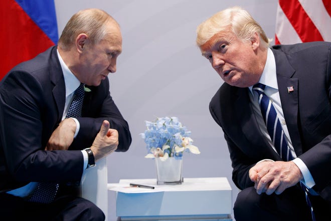 In this Friday, July 7, 2017, file photo U.S. President Donald Trump meets with Russian President Vladimir Putin at the G-20 Summit in Hamburg. The Kremlin and the White House have announced Thursday June 28, 2018, that a summit between Russian President Vladimir Putin and U.S. President Donald Trump will take place in Helsinki, Finland, on July 16.