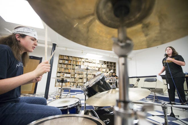 Colin Rooney, 15, of South Beloit, plays drums and Madalyn Johnson, 14, of Rockford, sings during rehearsals in the second week of the Rock and Roll Institute on Tuesday, June 26, 2018, at Mendelssohn Performing Arts Center in Rockford. [SCOTT P. YATES/RRSTAR.COM STAFF]