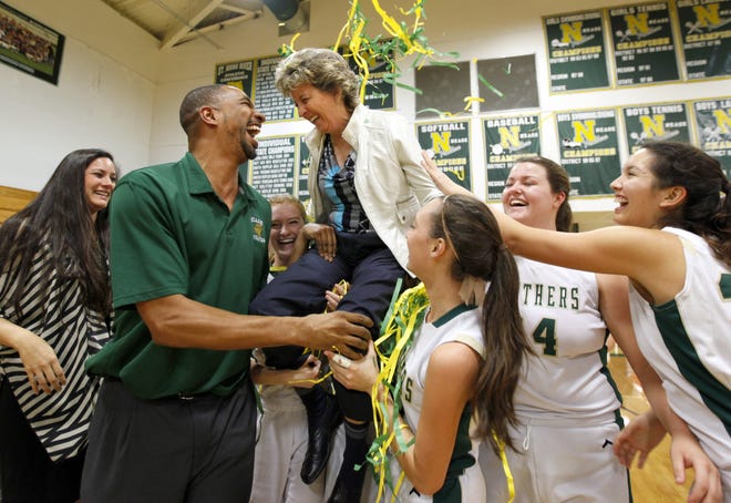 Nease assistant coach Terrence Washington, left, celebrates head coach Sherri Anthony's 500th career win on Jan. 22, 2015. Washington will be the new head girls basketball coach at Menendez High.

[DARON DEAN/St. Augustine Record]