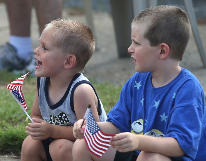 Brothers Eric and Sam Hidebrandt watch the Red, White & Blue Parade on July 4, 2016, in Lynn Haven. [PATTI BLAKE/NEWS HERALD FILE PHOTO]