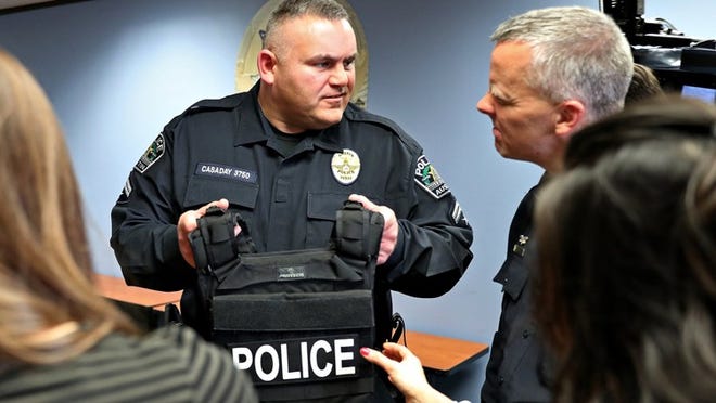 Austin Police Association President Ken Casaday speaks with Police Chief Brian Manley in February.