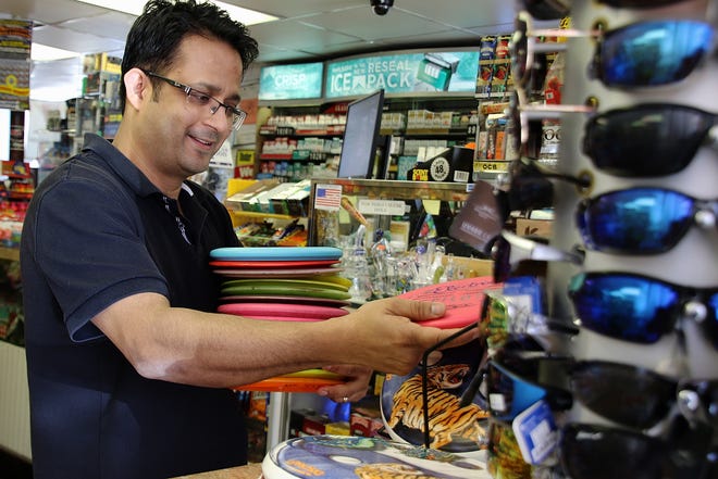 Samir Ojha provides a variety of disc golf must-haves at Marstons Mills Cash Market. (BP photo/William F. Pomeroy)