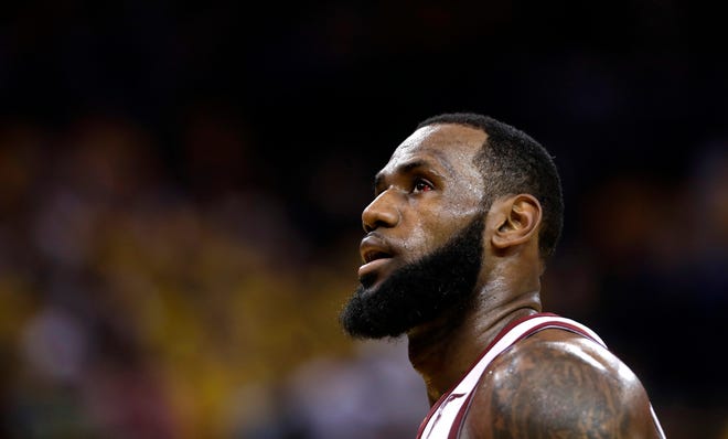 Two people familiar with the decision reportedly say LeBron James has told the Cavaliers he is declining his $35.6 million contract option for next season and is a free agent. [AP File Photo/Marcio Jose Sanchez]