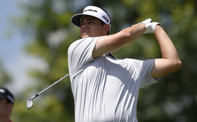 Beau Hossler watches his tee shot on the 17th tee during the second round of the Quicken Loans National golf tournament Friday in Potomac, Md. [AP Photo / Nick Wass]