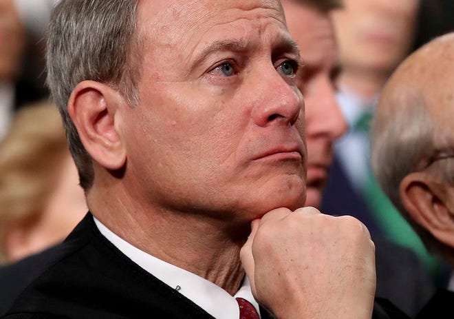 U.S. Supreme Court Chief Justice John Roberts listens as President Donald Trump delivers his first State of the Union address in the House chamber of the U.S. Capitol to a joint session of Congress in January.The retirement of Justice Anthony Kennedy means that the conservative Roberts probably will be the justice closest to the court’s four liberals, allowing Roberts to control where the court comes down in some of its most contentious cases.