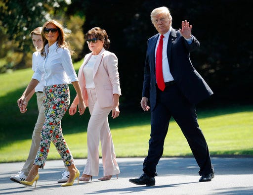 President Donald Trump, right, waves as he walks out, with from l-r., son Barron, first lady Melania Trump, and Amalija Knavs, mother of first lady Melania Trump, as they walk across the South Lawn of the White House in Washington, Friday, June 29, 2018, for the short flight to nearby Andrews Air Force Base, Md. (AP Photo/Pablo Martinez Monsivais)