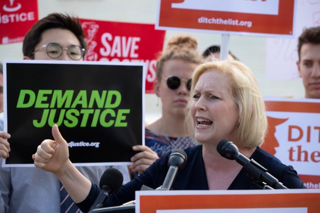 Sen. Kirsten Gillibrand, D-N.Y., joins activists at the Supreme Court as President Donald Trump prepares to choose a replacement for Justice Anthony Kennedy on Thursday in Washington. Gillibrand says Kennedy’s retirement sets up a situation where "women's lives are at risk." [J. Scott Applewhite/The Associated Press]