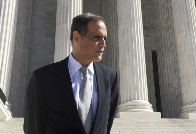 Florida resident Fane Lozman stands on the steps of the Supreme Court in Washington on Feb. 27, 2018, after oral arguments in his case. The Supreme Court sided with Lozman, who sued the City of Riviera Beach, where he lives, after being arrested for his speech during a public comment portion of a City Council meeting in 2006. [AP Photo/Jessica Gresko]