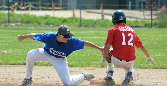 Relyco shortstop Alex Noel, left, tags, Tri-City Subaru's Devon Lapierre, but he doesn't have the ball during the Babe Ruth Inter-League championship series Saturday at Dunaway Field. [Mike Whaley/Fosters.com]