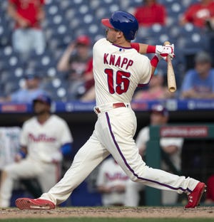 The Phillies' Andrew Knapp (15) follows through on a walkoff home run in the 13th inning Sunday against the Nationals. [AP PHOTO/LAURENCE KESTERSON]