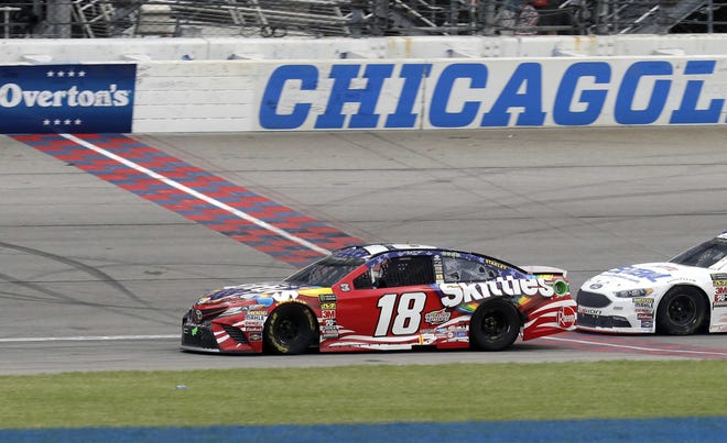 Kyle Busch crosses the finish line to win a NASCAR Cup Series auto race at Chicagoland Speedway in Joliet, Ill., on Sunday. [AP Photo / Nam Y. Huh]