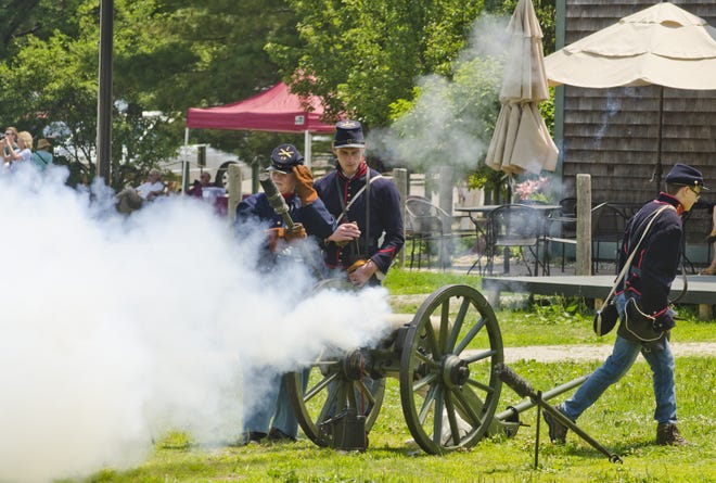 Members of the 1861 Corbin's Battery fire off a cannon for visitors of the Strawbery Banke Museum's 16th Annual American Celebration for Independence Day Holiday Sunday. [Daryl Carlson/Fosters.com]