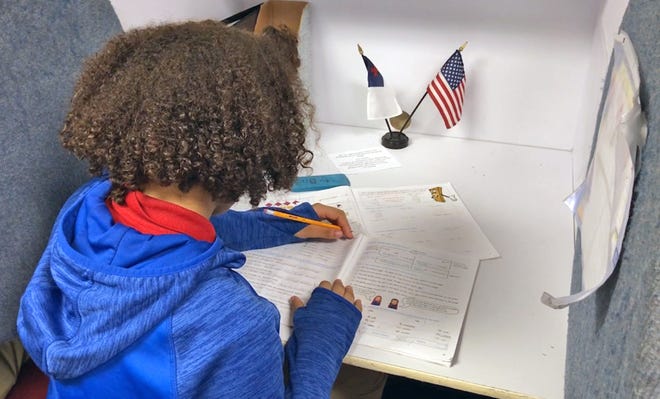 A student at Downey Christian School works on a page from an Accelerated Christian Education workbook earlier this year. [KAYLE O'BRIEN/ORLANDO SENTINEL]