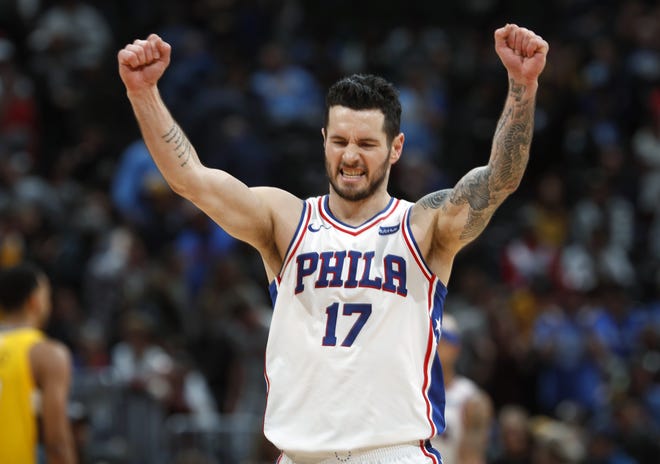 FILE - In this Dec. 30, 2017, file photo, Philadelphia 76ers guard JJ Redick celebrates in the final moments of a 107-102 win against the Denver Nuggets, in Denver.Redick is returning to the 76ers. A person familiar with the decision says the Sixers and Redick have agreed to a one-year contract. The person spoke to The Associated Press Monday, July 2, 2018, on condition of anonymity because the deal was not been announced. (AP Photo/David Zalubowski, File)