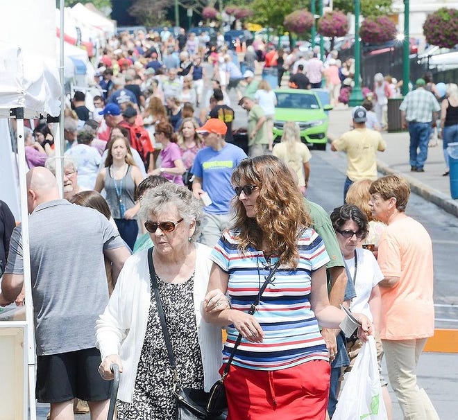 Sauquoit resident Becky Maugeri, front right, holds her mother Rosemary Warren's arm while walking around during the 2017 Little Falls Cheese Festival. [OBSERVER-DISPATCH FILE PHOTO]