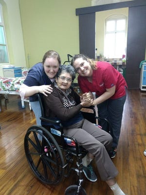 Holland native and Davenport University nursing student Jordyn Breuker, right, volunteered in a nursing home during her study abroad trip in Costa Rica. [Contributed]