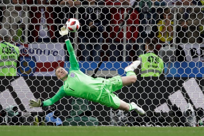 England goalkeeper Jordan Pickford saves a penalty during the round of 16 match against Colombia on Tuesday night inside Moscow's Spartak Stadium. [MATTHIAS SCHRADER/THE ASSOCIATED PRESS]