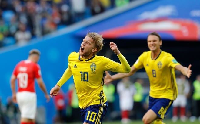Sweden's Emil Forsberg celebrates the opening goal during the round of 16 match between Switzerland and Sweden at the 2018 World Cup in St. Petersburg on Tuesday. [Efrem Lukatsky/The Associated Press]