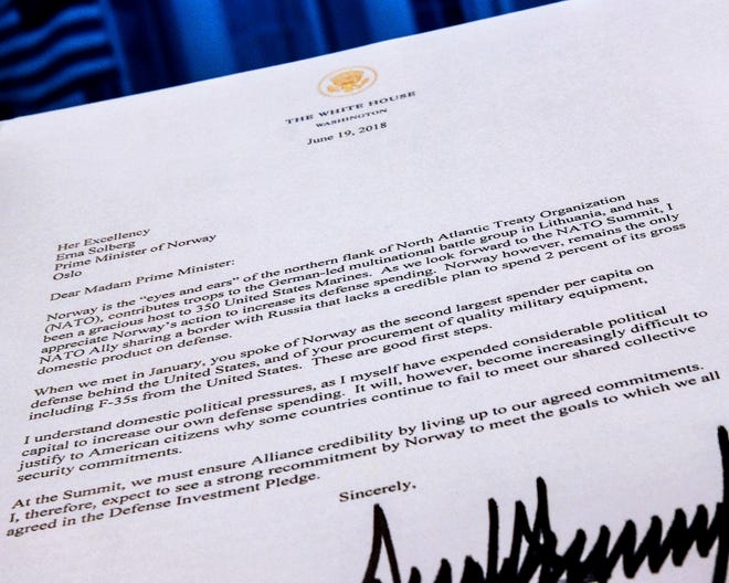 A copy of a letter sent to the Prime Minister Erna Solberg of Norway by U.S. President Donald Trump demanding an increase in Norway's NATO spending is photographed in Washington, Tuesday, July 3, 2018. The letter was supplied to the Associated Press by the Norwegian Defense Ministry. (AP Photo/J. David Ake)