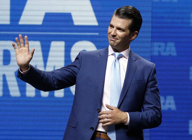 Donald Trump Jr. waves from the stage at the National Rifle Association in Dallas on May 4. [AP Photo/Sue Ogrocki, File]