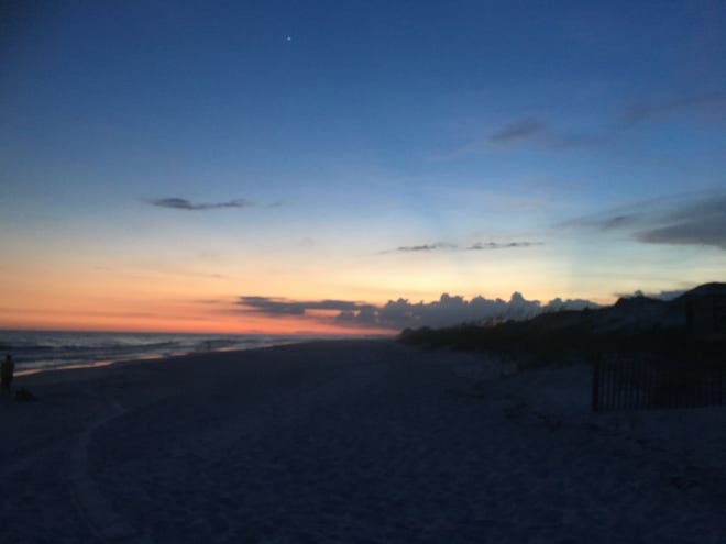 Sunset fades on a night last week at Grayton Beach. [TONY SIMMONS/THE NEWS HERALD]