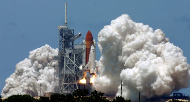 The space shuttle Discovery lifts off at the Kennedy Space Center in Cape Canaveral on mission STS-121 on July 4, 2006. [Dave Martin/The Associated Press]