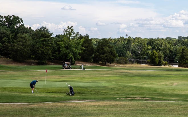 Golfers enjoy a quiet, scenic afternoon playing at Winding Creek Golf Course in Thomasville on Thursday. Winding Creek will be DCCC's home course. [Dan Busey/The Dispatch]