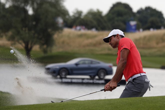 Bartram Trail grad Julian Suri hits a bunker shot during the final round of the French Open last week. Suri tied for second and locked up a spot in the British Open in two weeks. [Francois Mori/The Associated Press]