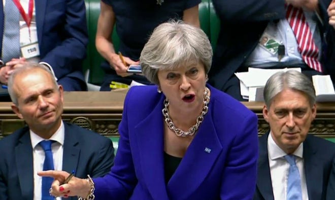 Britain's Prime Minister Theresa May speaks during Prime Minister's Questions in the House of Commons, London, Wednesday July 4, 2018. (PA via AP)