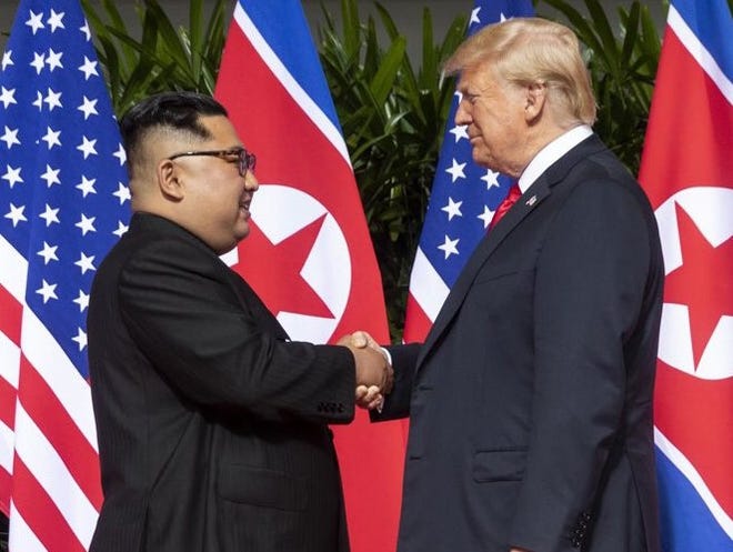 Kim Jong-Un (left) and President Donald Trump [ DAN SCAVINO JR. / ASSISTANT TO POTUS ]