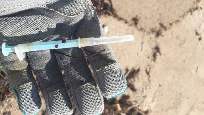 This syringe was found along the Palm Beach shoreline in December. Diane Buhler and her Friends of Palm Beach cleanup group frequently find medical waste on private beaches in town. Courtesy Diane Buhler.