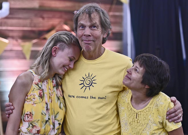 Isabella Smith, 17, with her parents Chris and Renee Smith, at a June 14 benefit put on by her classmates at Booker High School's VPA theater department to raise funds after she underwent emergency brain surgery following a freak accident in a dance rehearsal. The benefit raised over $5,000. [Herald-Tribune staff photo / Thomas Bender]