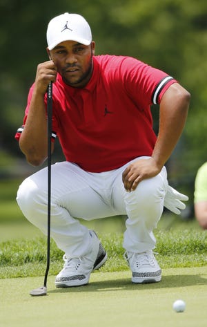 Harold Varner III looks at a putt on the first hole during the third round of the Military Tribute at The Greenbrier golf tournament in White Sulphur Springs, W.Va., Saturday, July 7, 2018. (AP Photo/Steve Helber)