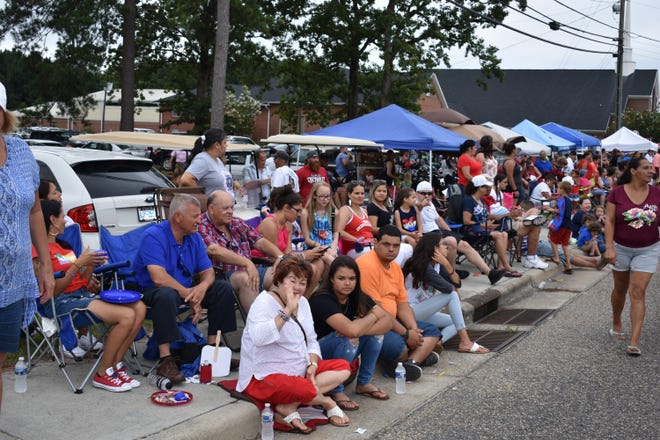 People gather to watch the parade for the 50th anniversary of Lumbee Homecoming on Saturday morning, July 7, 2018 i in Pembroke. [James Locklear/contributed]
