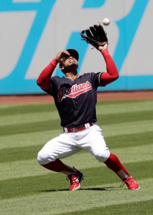 Cleveland Indians' Francisco Lindor cannot get to a ball hit by Oakland Athletics' Mark Canha in the first inning of a baseball game, Sunday, July 8, 2018, in Cleveland. Canha was safe at first base. (AP Photo/Tony Dejak)