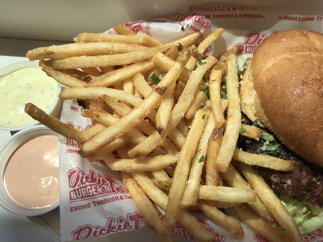 At Dickie Jo's Burgers, the menu includes four types of French fries. The Truffle Fries, pictured here, are seasoned with truffle oil, Parmesan cheese and Italian parsley. [Joel Gorthy/The Register-Guard] - registerguard.com