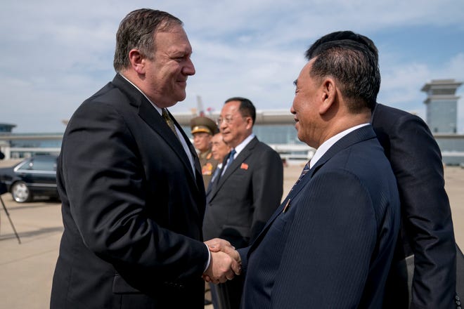 U.S. Secretary of State Mike Pompeo, says goodbye to Kim Yong Chol, a North Korean senior ruling party official and former intelligence chief, before boarding his plane at Sunan International Airport in Pyongyang, North Korea, on Saturday to travel to Japan. Pompeo described two days of meetings with Chol as "productive, good faith negotiations" in the ongoing effort towards denuclearization, and plans have been set to discuss the process of repatriation of remains next week in Panmunjom. [Andrew Harnik/The Associated Press]